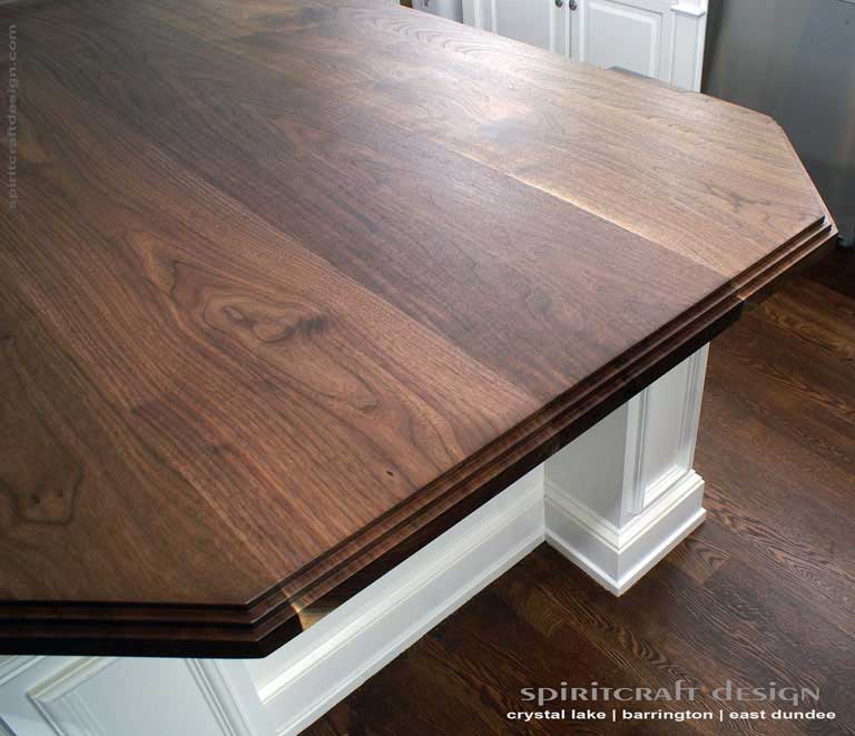 Interior Design Accents - Solid hardwood Walnut slab kitchen island top in Glenview, Illinois by Spiritcraft Design Furniture of East Dundee, IL